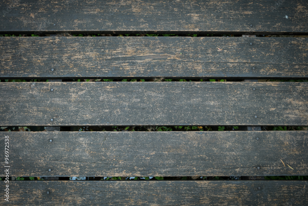 old wooden walkway with falling leaves in the morning of autumn old wooden walkway with falling leaves in the morning of autumn