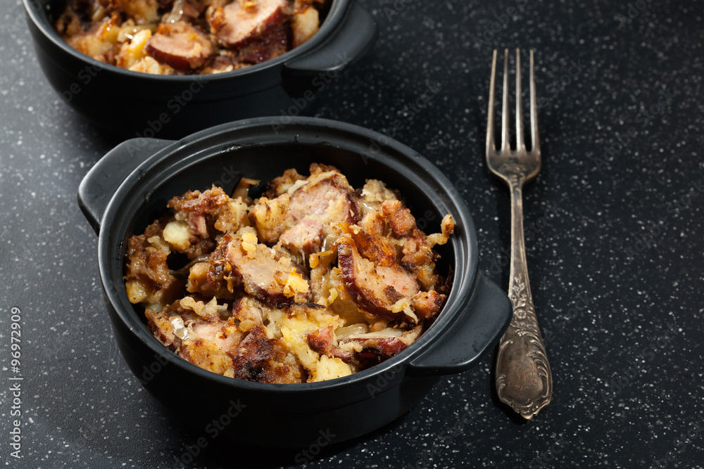 Potatoes baked with sausage and bacon Potatoes baked with sausage and bacon