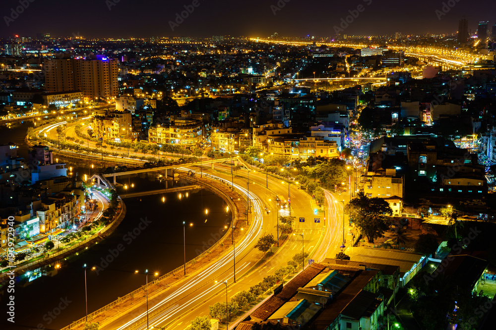 Panoramic view of Vo Van Kiet highway, Ho Chi Minh city (or Saigon) by night, Vietnam. Saigon is the largest city and economic center in Vietnam with population around 10 million people.