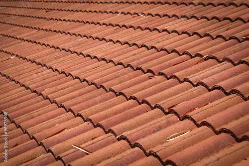 brown tile roof weathered on building residential