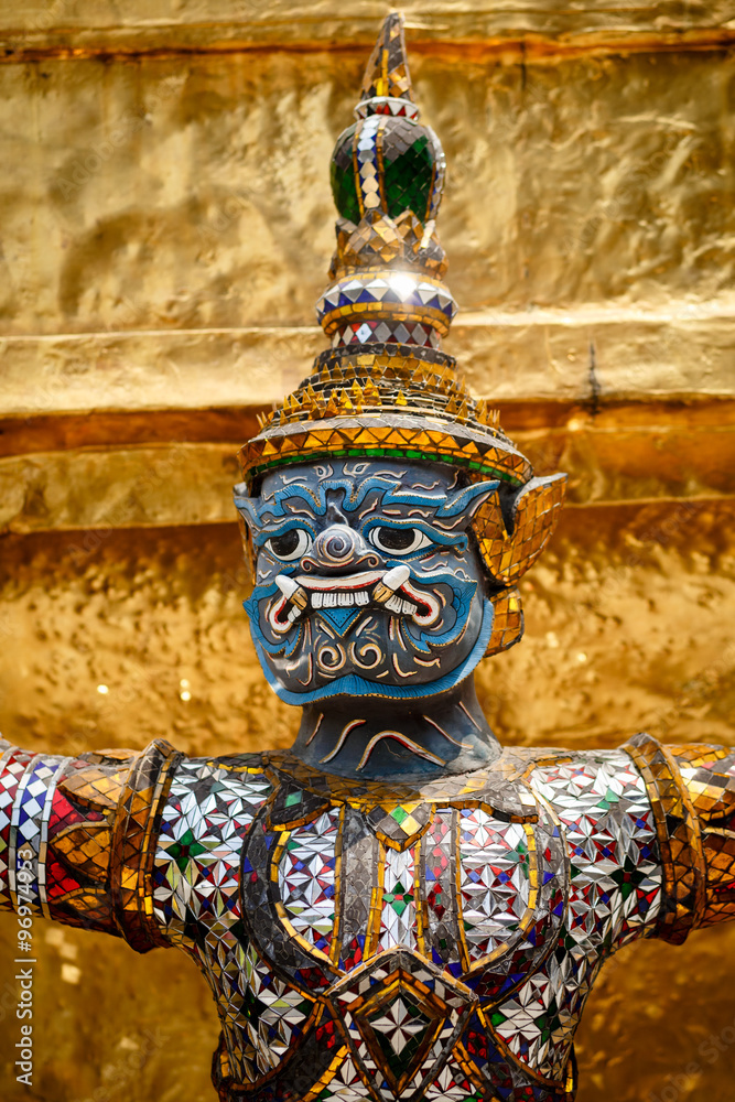 Fototapeta premium Close-up of demon guarding Golden Stupa at Wat Phra Kaeo in the Grand palace, Bangkok, Thailand