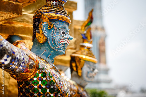 Canvas Print Demons guarding Golden Stupa at Wat Phra Kaeo in the Grand palace, Bangkok, Thai