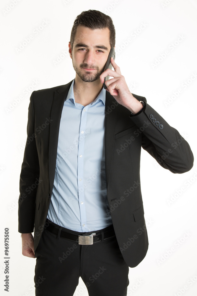 Young Man talking on the phone and smiling Young Man talking on the phone and smiling