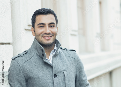 Close-up of a happy smile man wearing coat, coldly morning. Autmn day