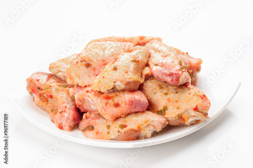 raw chicken wings on plate