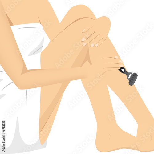 woman razoring legs with a grey razor