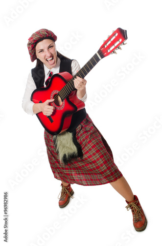 Woman in scottish clothing with guitar