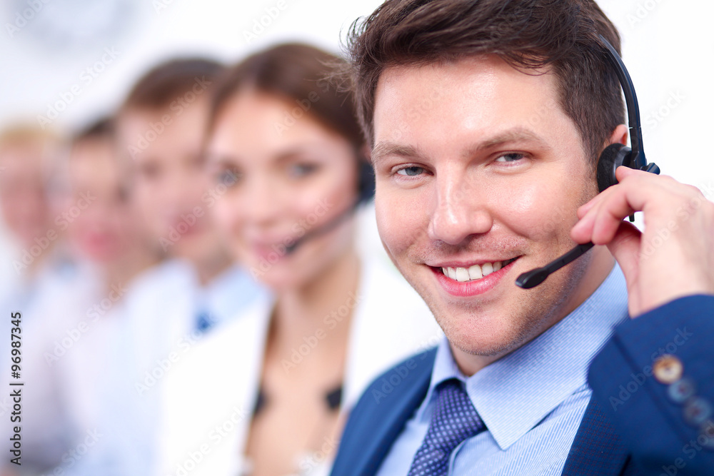 Attractive Smiling positive young businesspeople and colleagues in a call center office Attractive Smiling positive young businesspeople and colleagues in a call center office