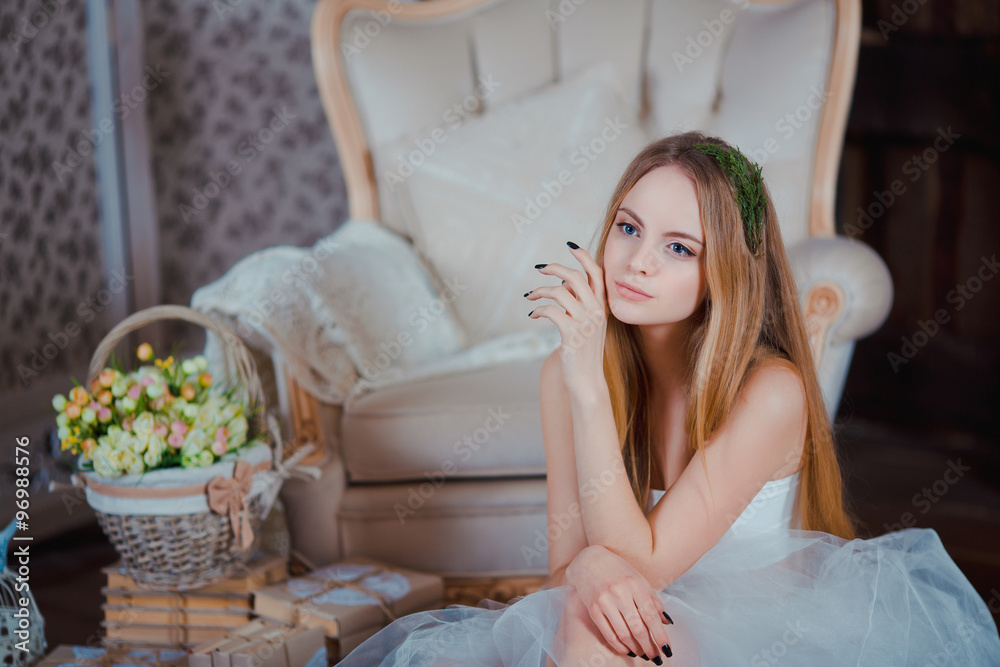Portrait of young beautiful girl with flower wreath in rustic wood interior Portrait of young beautiful girl with flower wreath in rustic wood interior