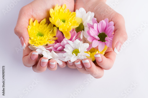 Colorfui flowers in the hands. photo