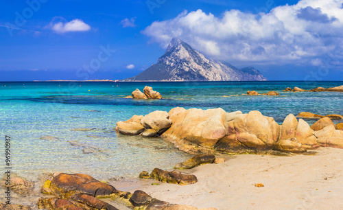 Fototapeta Naklejka Na Ścianę i Meble -  Amazing Sardegna scenic beaches with turquoise crystal sea. view of island Tavolara, Italy summer holidays