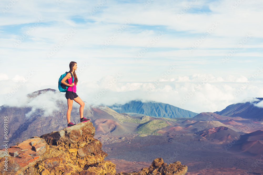 Woman hiker in the mountains enjoying the outdoors Woman hiker in the mountains enjoying the outdoors