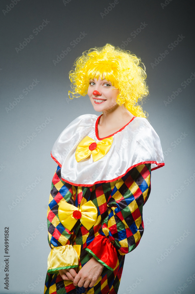 Clown in funny concept on dark background Clown in funny concept on dark background