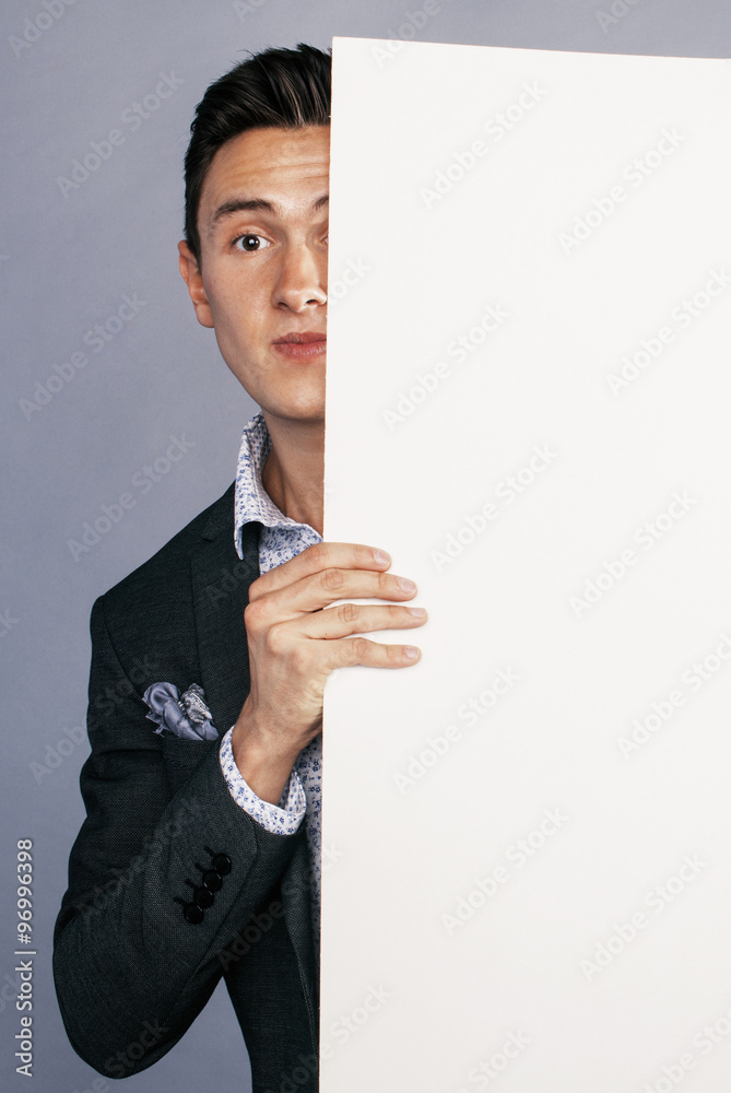 young handsom businessman in suit with poster empty copy space smiling young handsom businessman in suit with poster empty copy space smiling