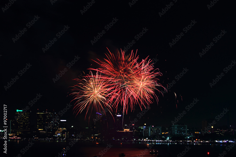 fireworks at the sea and city on background