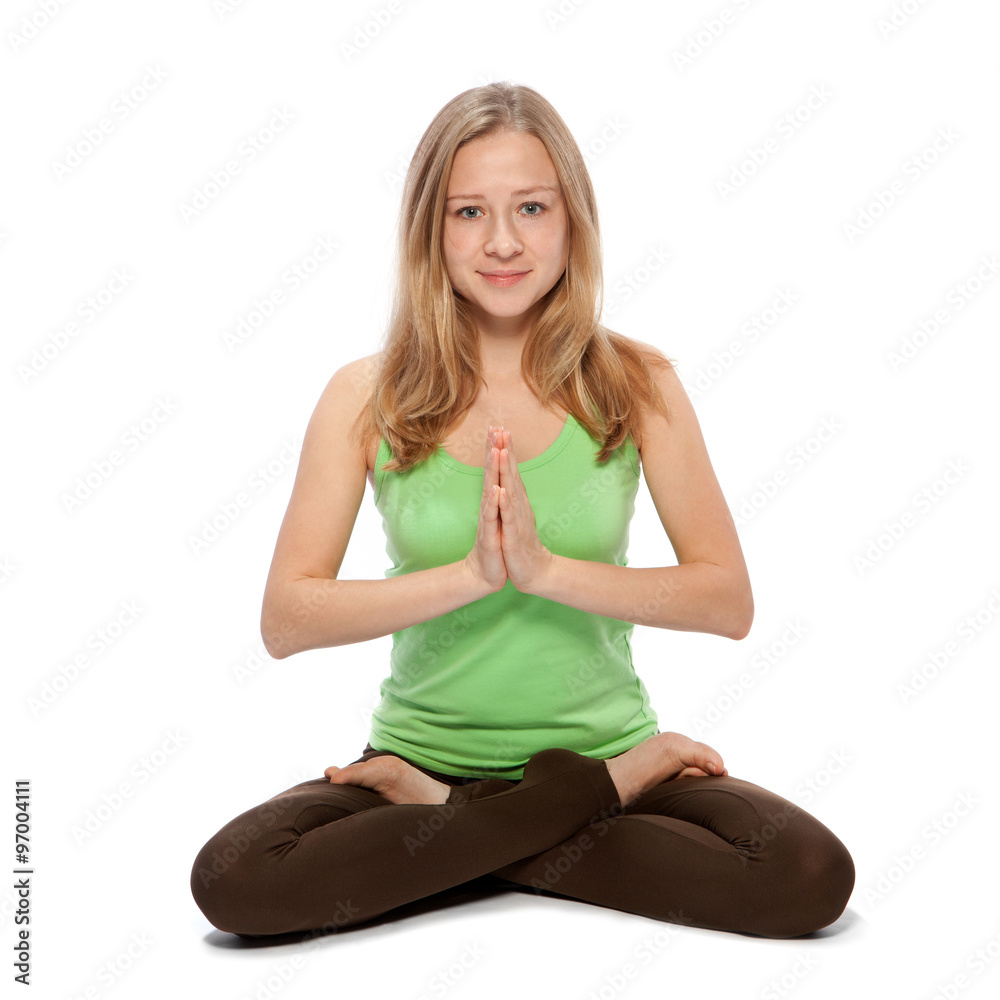 Young woman doing yoga on a white background