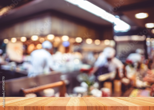 Empty wood table with blur restaurant background,Mock up Templat