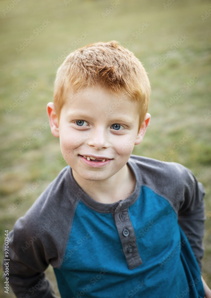 Cute and Silly Little red haired boy portrait outdoors Cute and Silly Little red haired boy portrait outdoors
