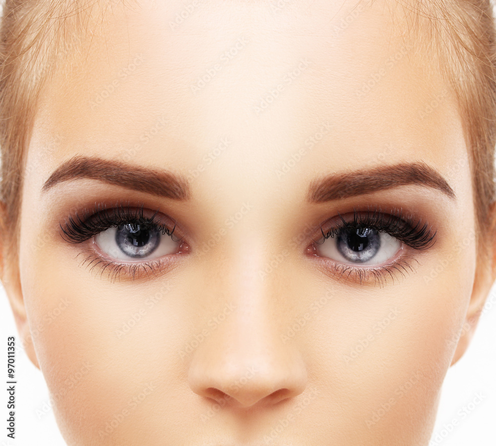 Woman blue eye with makeup and long eyelashes Woman blue eye with makeup and long eyelashes