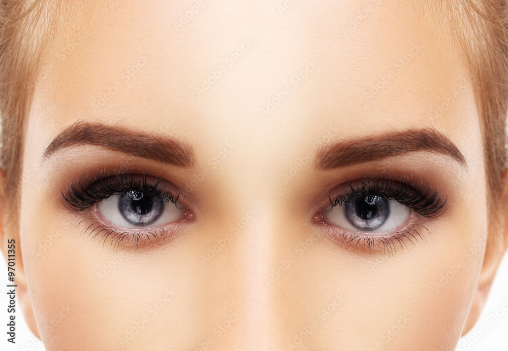 Naklejka premium Woman blue eye with makeup and long eyelashes