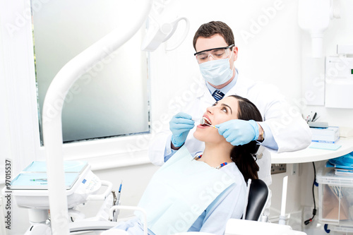 Patient getting treated by orthodontist photo