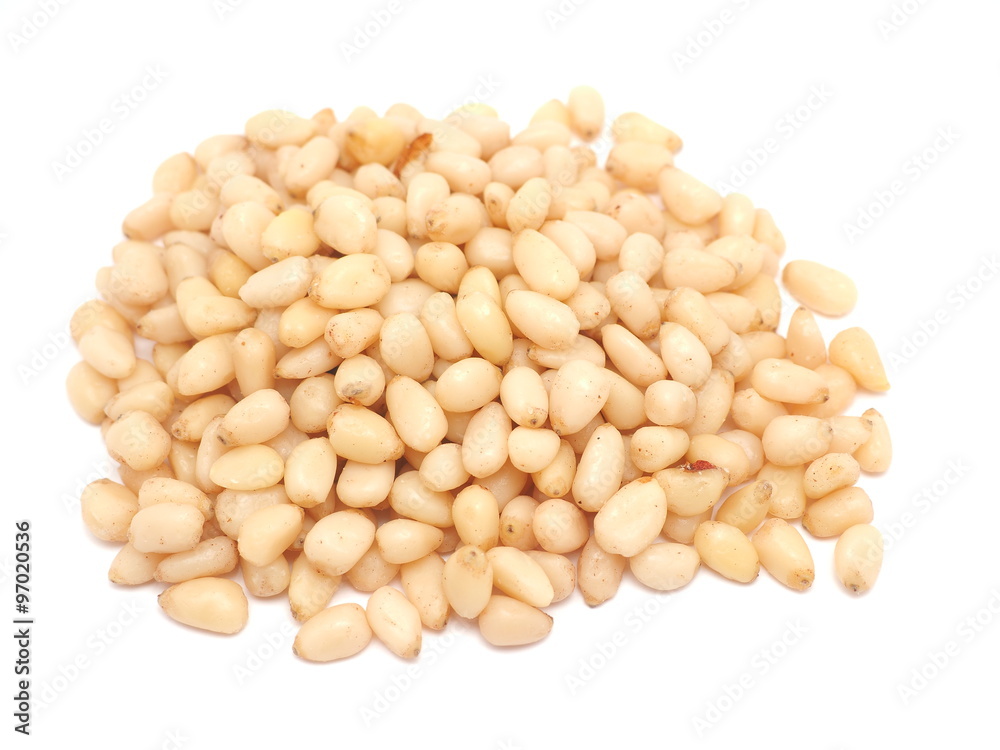 Peeled pine nuts on a white background Peeled pine nuts on a white background