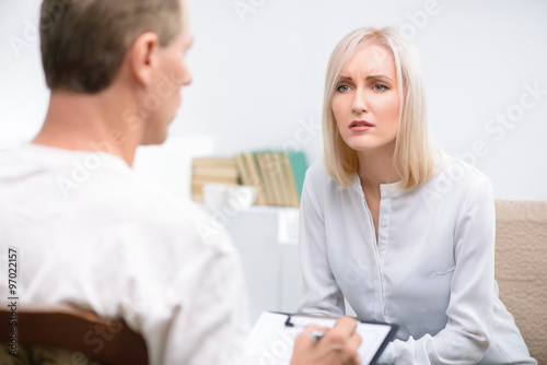Woman speaking with psychologist