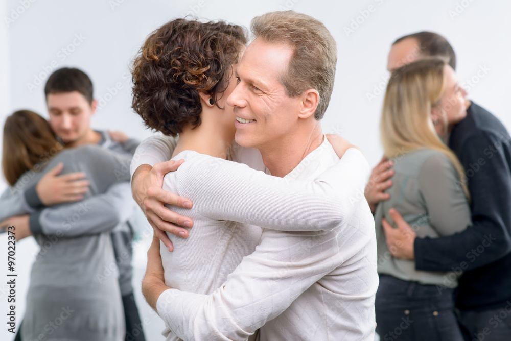Psychologist working with group of people Psychologist working with group of people