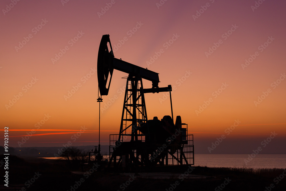 Oil derricks in sunset Oil derricks in sunset