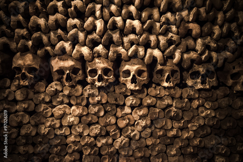 Skulls and bones in Paris Catacombs photo