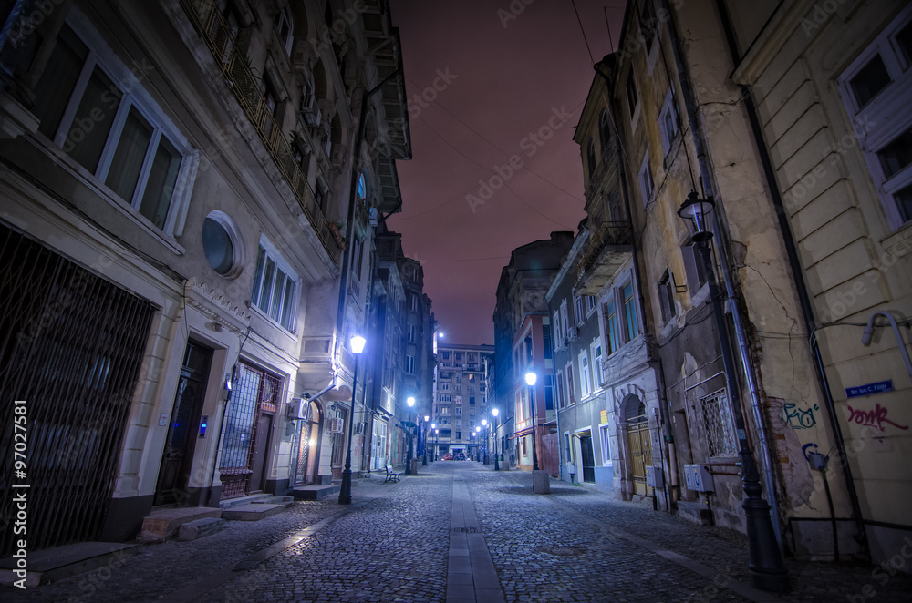 Bucharest, Romania – August 23, 2014: Night street scene in Bucharest old city.