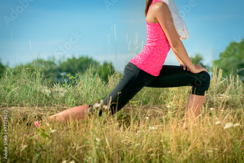 Attractive female stretching before jogging