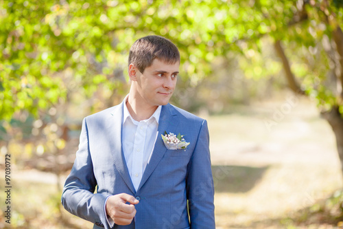 man in a suit on the nature