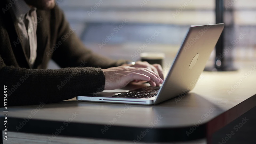 Man working on laptop computer in the workplace Man working on laptop computer in the workplace