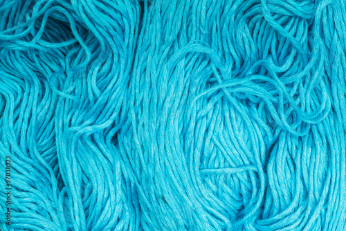 Closeup pile of blue yarn texture background
