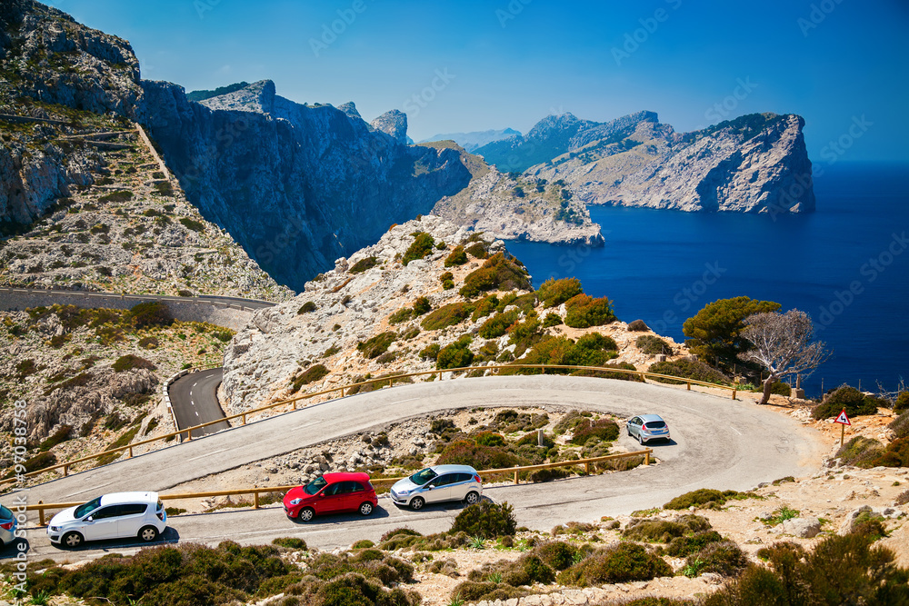 winding road with parked cars on the Cap de Formentor - obrazy, fototapety, plakaty 