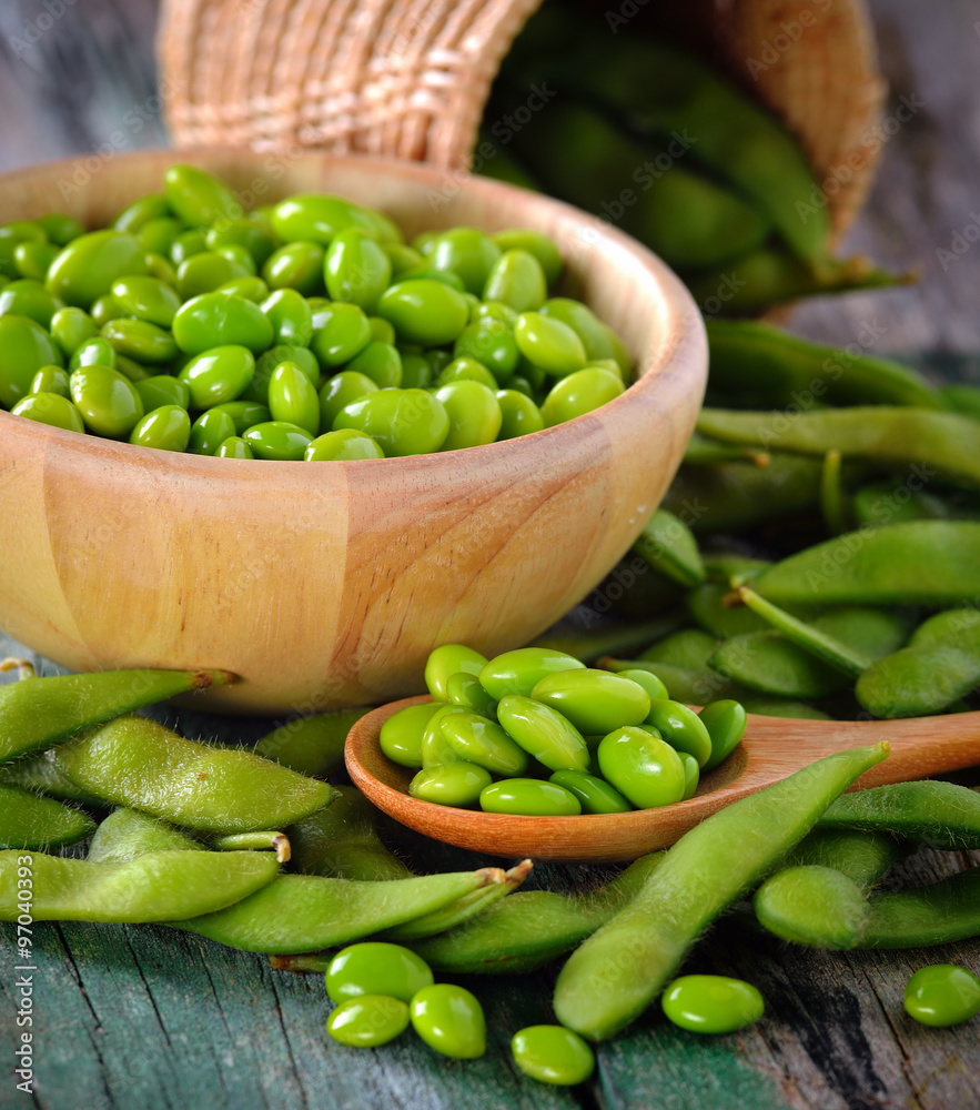 green soy beans in the wood bowl on table green soy beans in the wood bowl on table