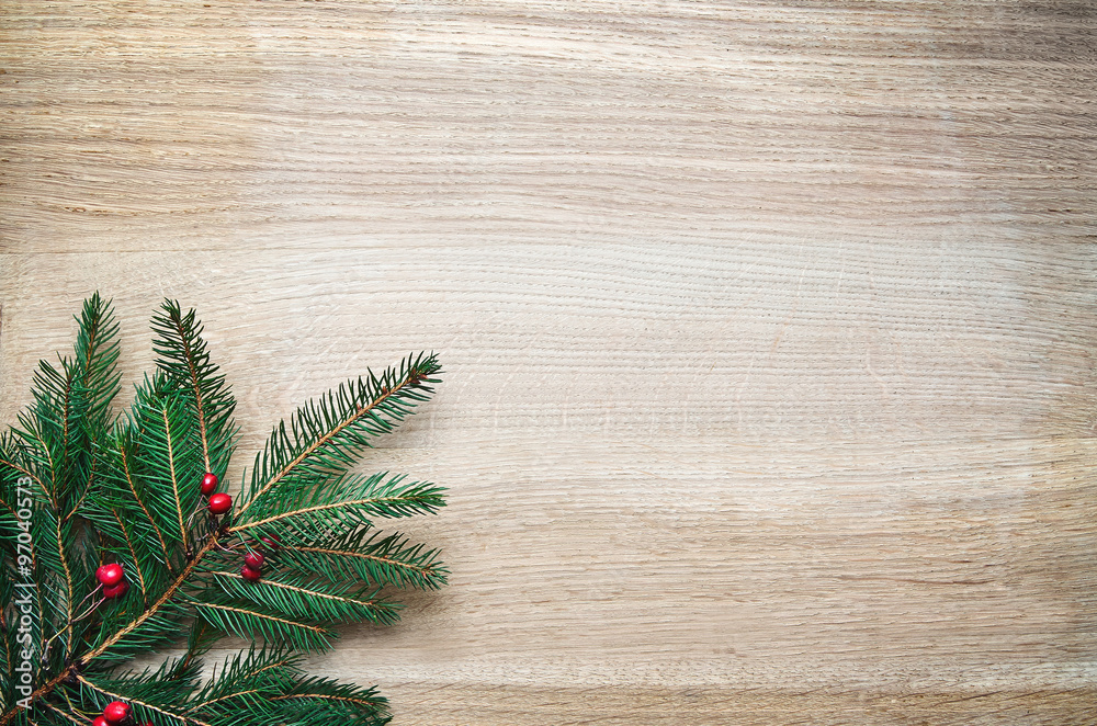 Christmas tree and viburnum berries ornament on rustic oak wooden background space for lettering Christmas tree and viburnum berries ornament on rustic oak wooden background space for lettering