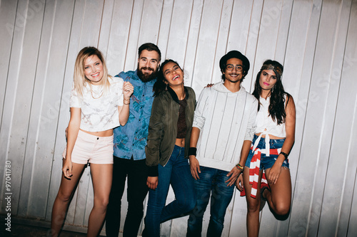 Fotografie Multiracial young people hanging out at night