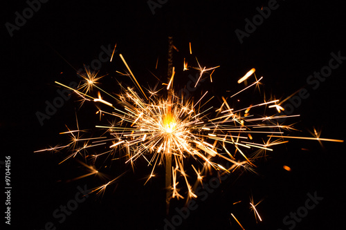 Christmas and New Year party sparkler on black