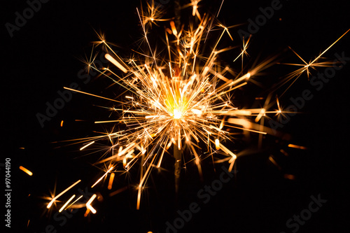 Christmas and New Year party sparkler on black