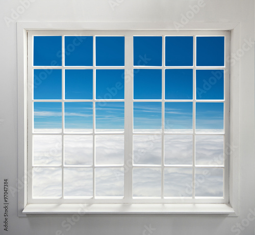 Modern residential window with heavenly view above clouds