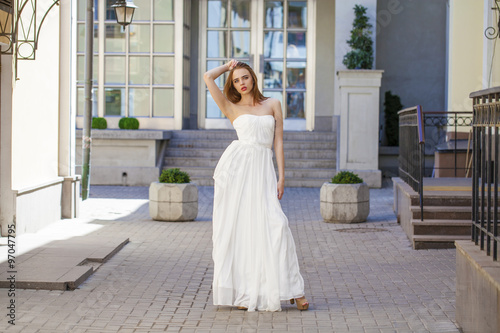 Full length portrait of beautiful model woman with long legs wea © Andrey_Arkusha