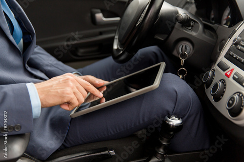 close up of young man with tablet pc driving car © Syda Productions