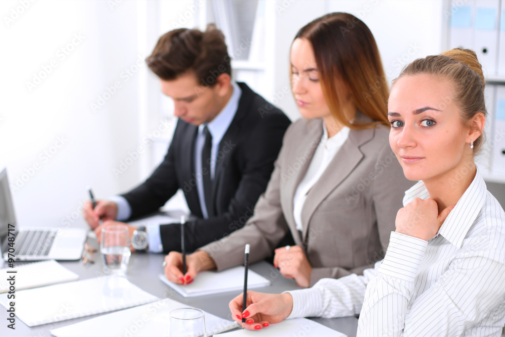 Group of Business people at meeting, focus on blond business woman Group of Business people at meeting, focus on blond business woman
