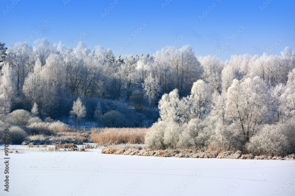 Winter landscape with frozen lake Winter landscape with frozen lake