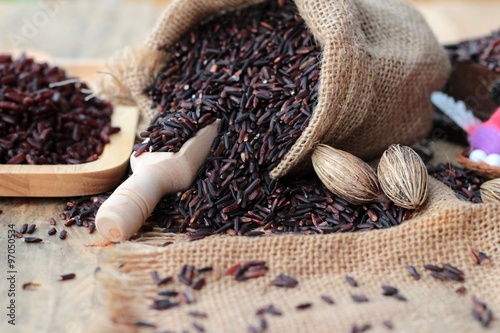 Raw purple rice berries and cooked of delicious for health.