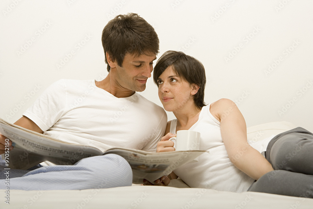 Couple reading newspaper Couple reading newspaper