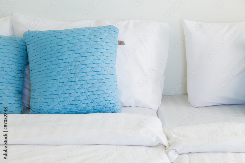 light blue pillows white mattress bed, soft focus light blue pillows white mattress bed, soft focus