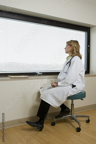 Doctor looking out of window